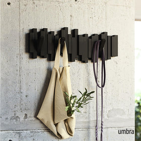 Umbra Sticks five flip-down hooks extended for quick everyday organization.