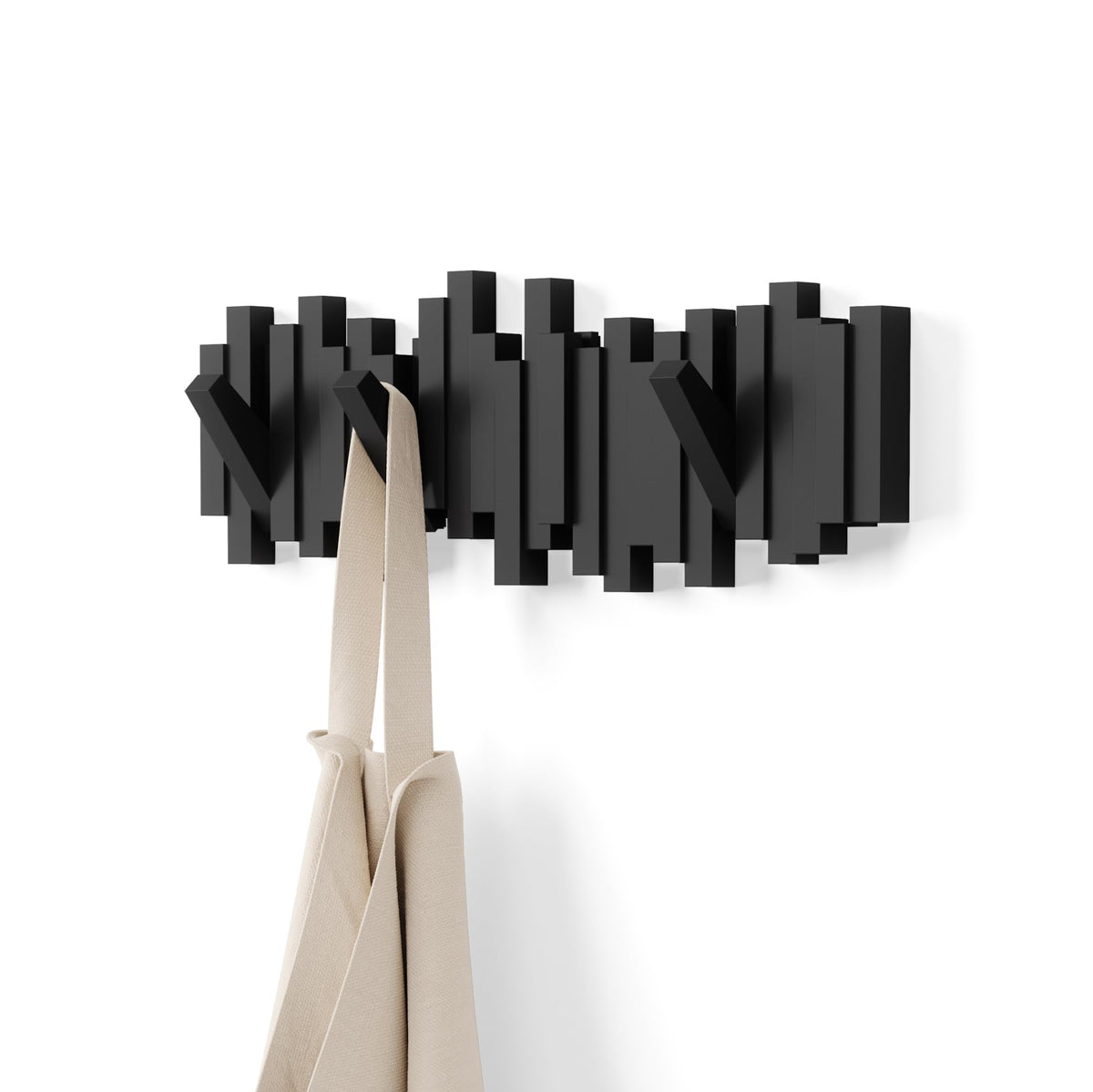 Umbra Sticks wall-mounted coat rack rail for a sleek, space-saving entryway.