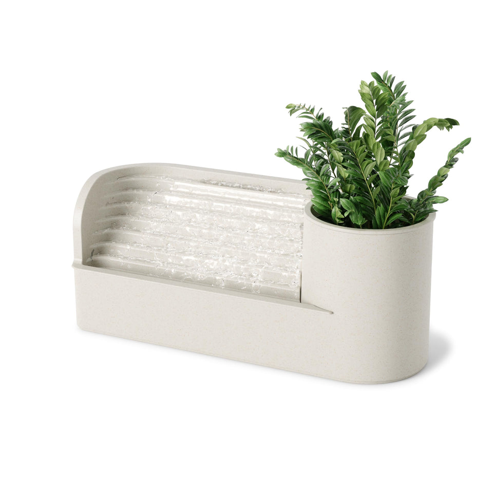 Umbra Stream Water Fountain on a desk with calming water flow for a peaceful workspace.