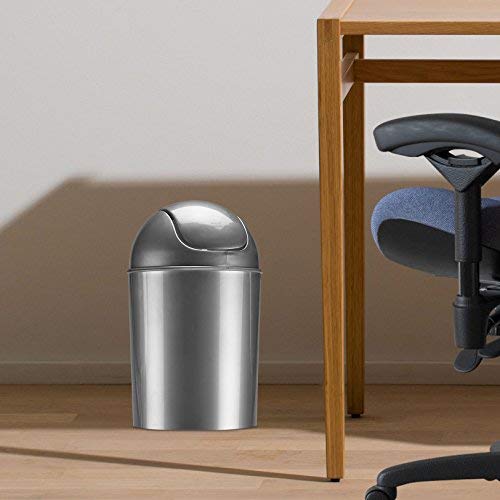 Umbra swing-top lid mini trash bin ideal for compact spaces.