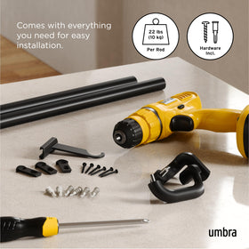 Umbra Twilight wrap-around design keeps curtains flush against wall for privacy.
