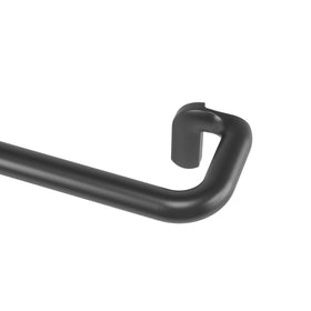 Umbra Twilight curtain rod with wrap-around ends blocks light for a cozy bedroom.