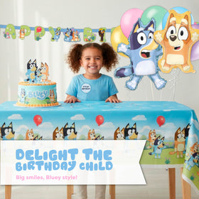 Unique Bluey candles and sticker complete the birthday setup