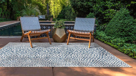 Unique Loom Cape Town outdoor rug blue olive; patio setting emphasizes versatile outdoor use.
