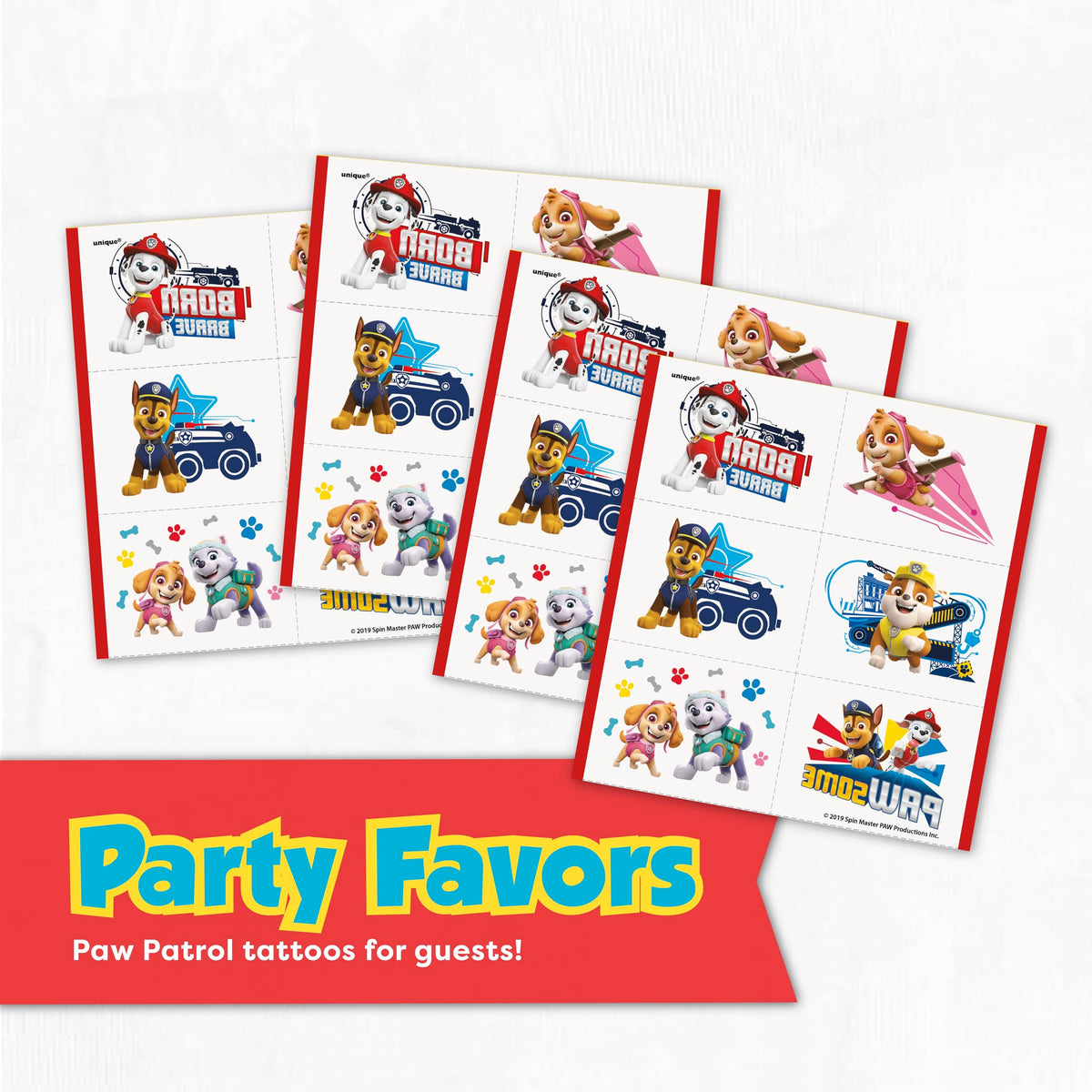 Unique Paw Patrol cake candles and temporary tattoos for celebration fun.