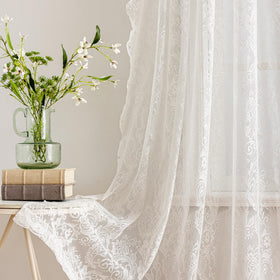 UNISTAR light-filtering lace softly moderates glare while preserving daylight.