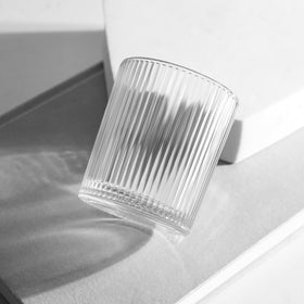 Uniteland clear glass tea light holder enhances ambiance during celebrations.