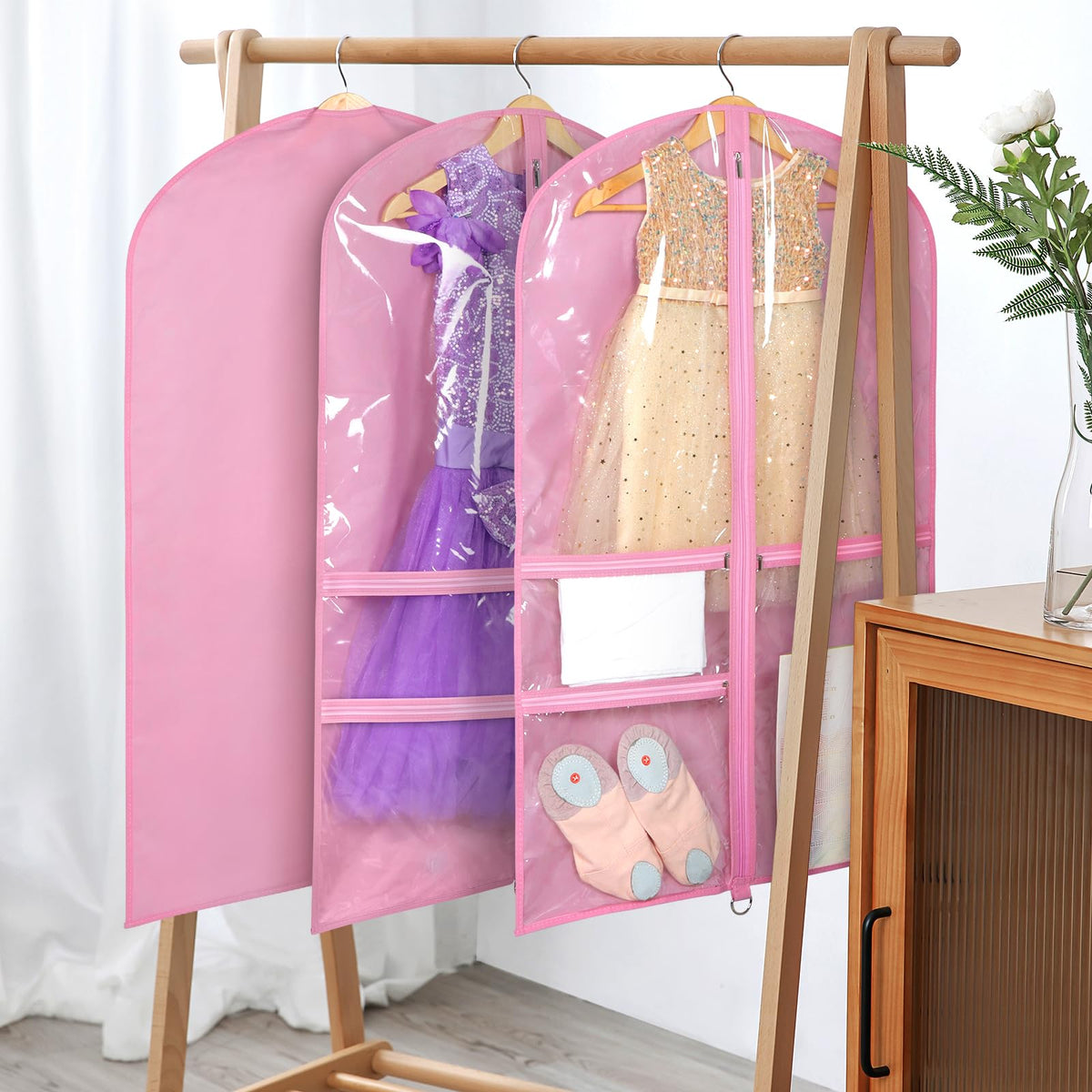 Univivi breathable pink costume bag protects contents from moisture during transport.