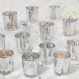 UPBUD votive candle holders 24-piece set beams warm ambience with speckled mercury glass.