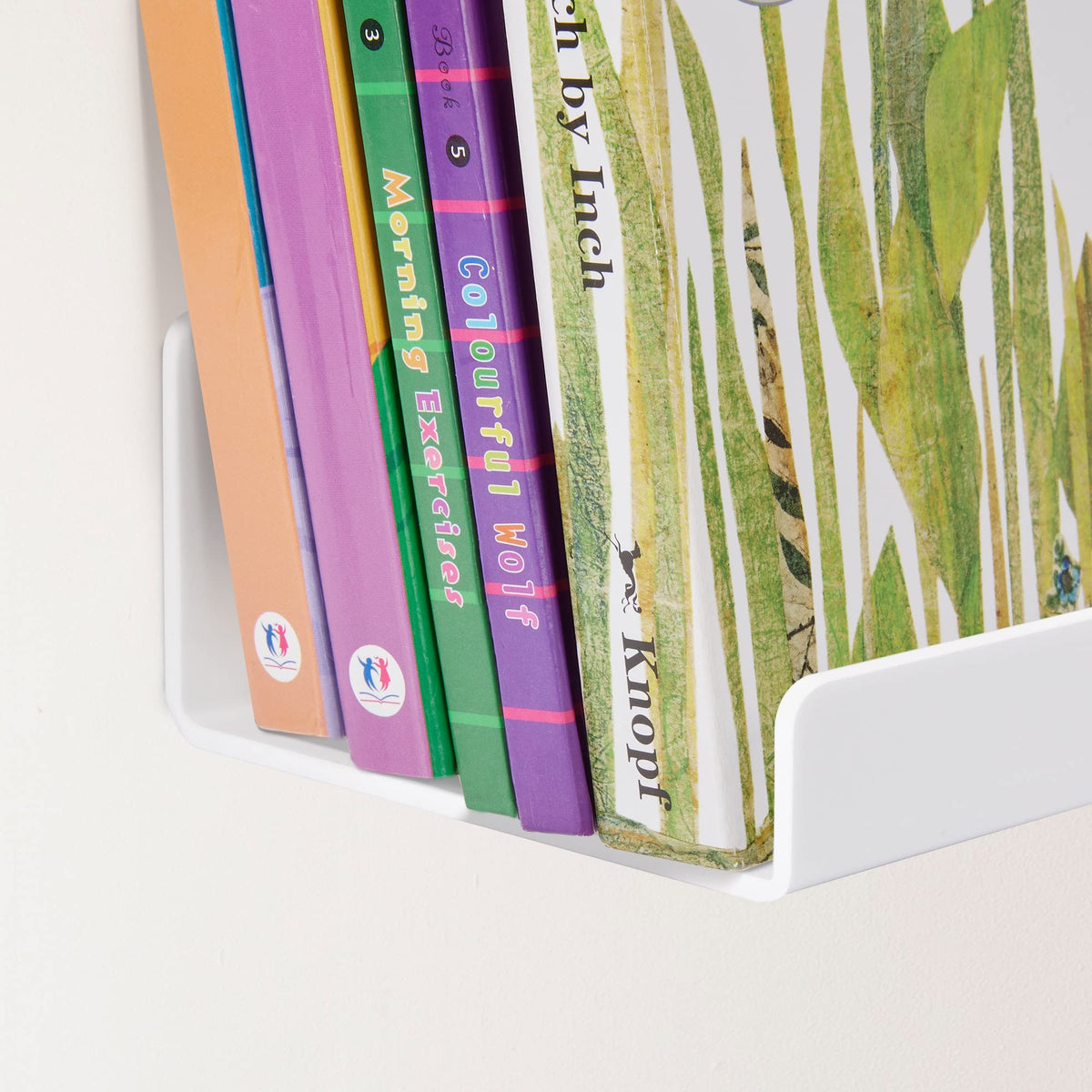 Upsimples floating shelves in bathroom for toiletries and decor.