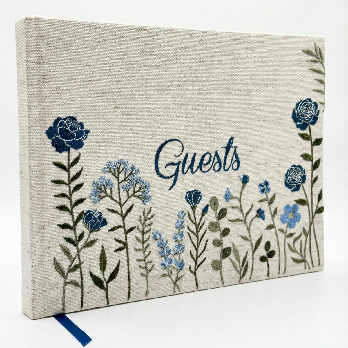 Upstart Decor linen-embroidered cover showing elegant floral stitching for weddings.