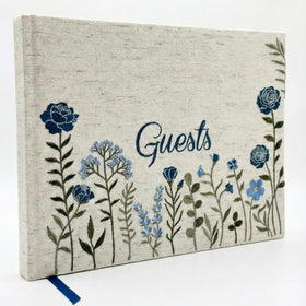 Upstart Decor linen-embroidered cover showing elegant floral stitching for weddings.