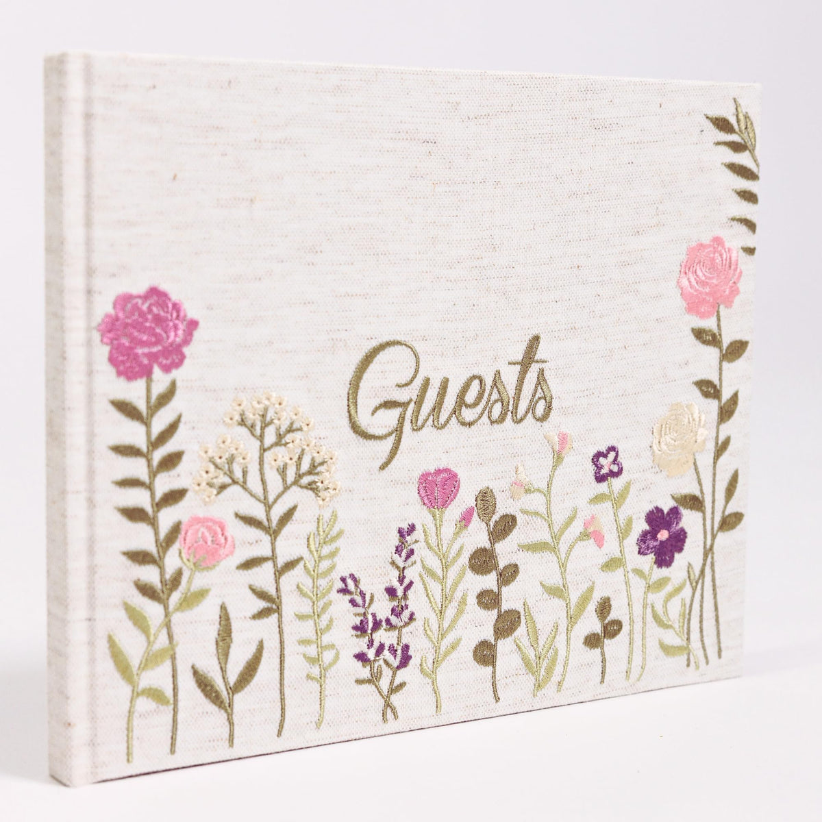 Upstart Decor linen-embroidered guest book cover with pink floral stitching.