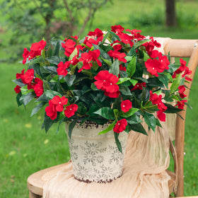 Uqueeten artificial impatiens red bouquet shown for outdoor decoration.