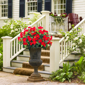 Uqueeten faux flowers in vase provide maintenance-free tabletop decor.