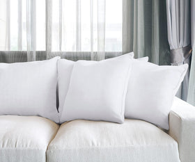 Utopia Bedding 20x20 inch pillows arranged on a neatly made bed.