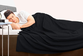 Utopia Bedding blanket styled on bed, lightweight and breathable for spring evenings.