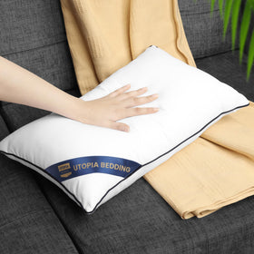 Utopia Bedding cushion inserts with navy piping enhance room accents.