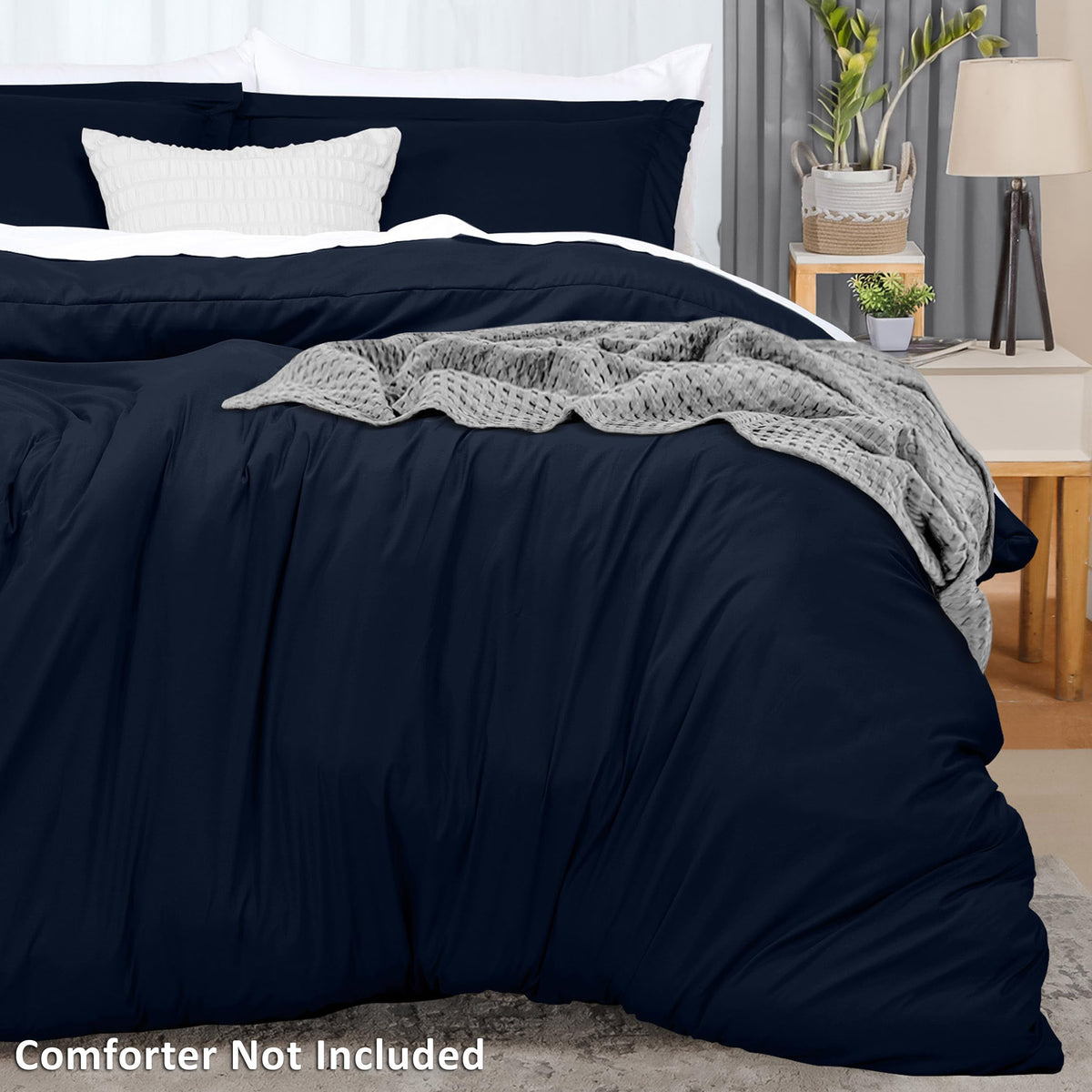 Duvet cover folded neatly in navy for a neat presentation