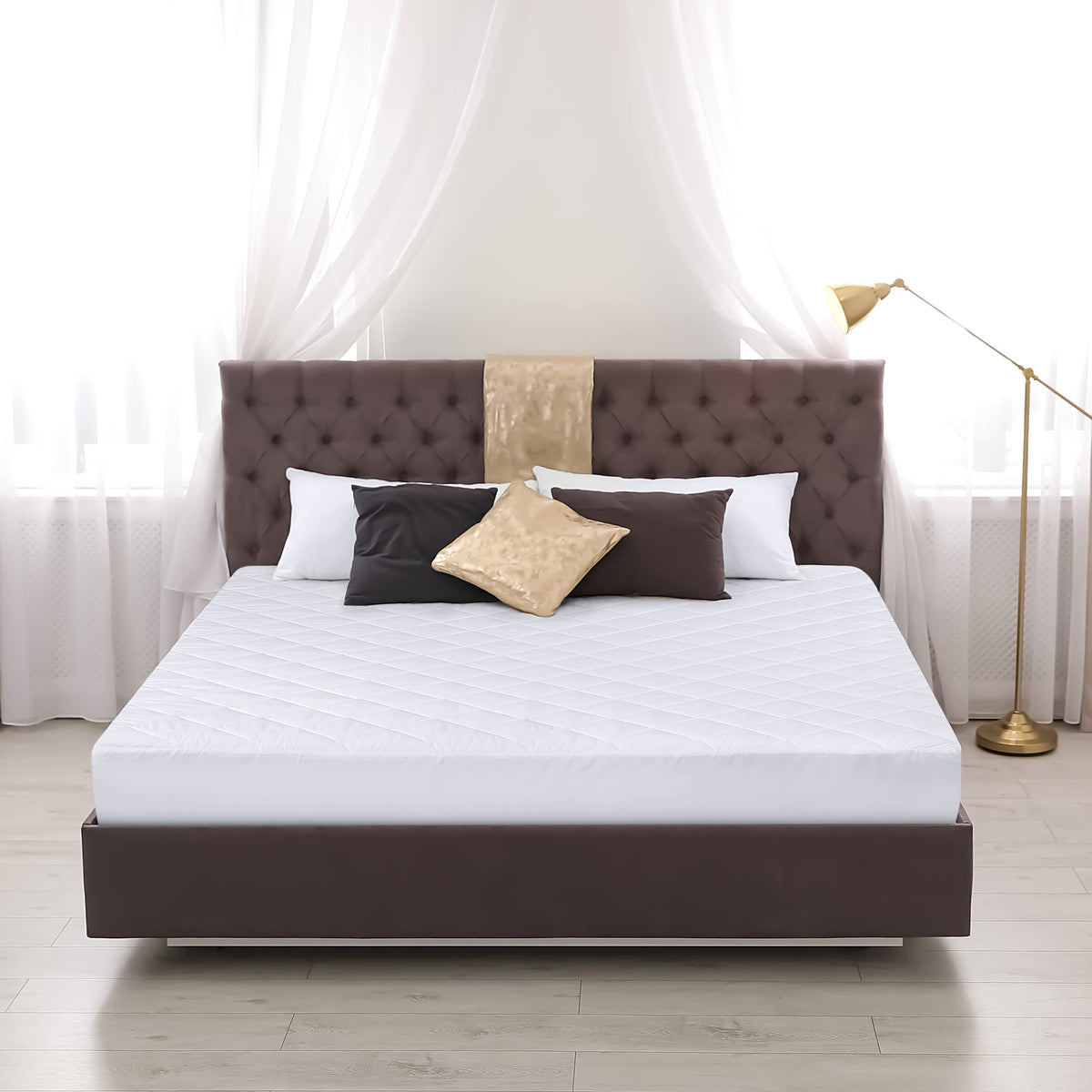Utopia Bedding easy-care white mattress pad ready for machine washing.