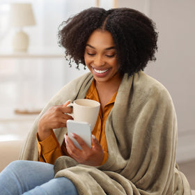 Utopia Bedding camel fleece blanket on couch during movie night