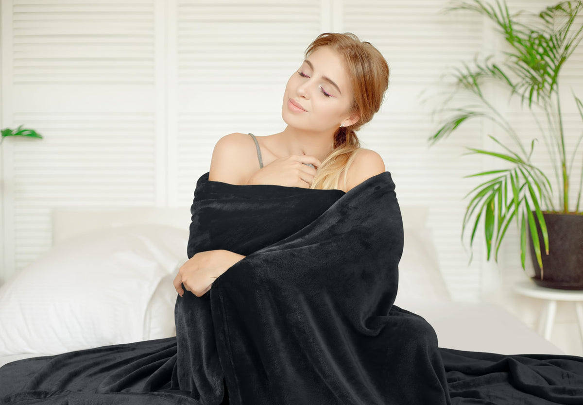 Utopia Bedding fleece blanket on couch for movie-night coziness