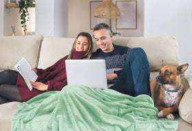 Utopia Bedding fleece blanket on a sofa invites quick naps and movie nights.