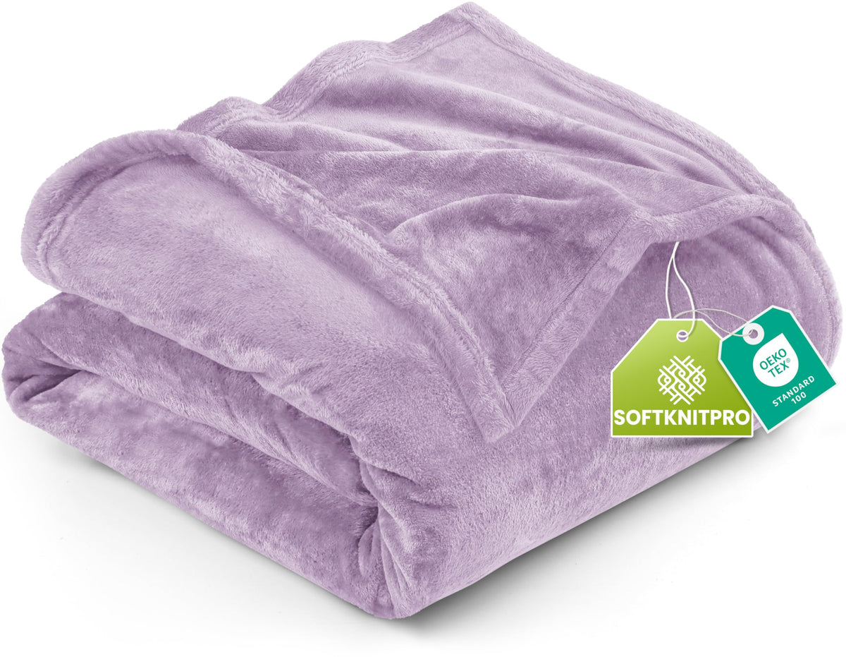 Utopia Bedding lilac fleece blanket on bed for cozy warmth.