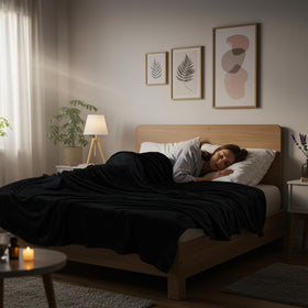 Utopia Bedding fleece blanket on bed - queen black - durable double-needle stitching for longevity.