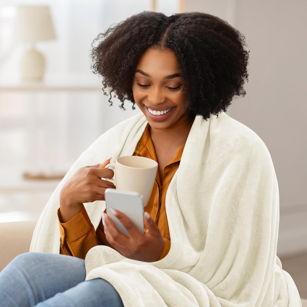 Utopia Bedding blanket draped over bed adds elegant, versatile comfort.