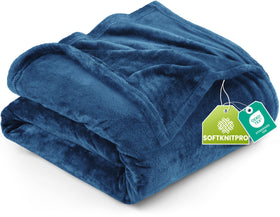 Utopia Bedding fleece blanket in royal blue on bed for luxurious warmth