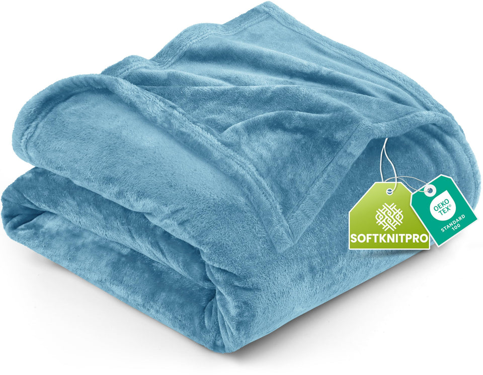 Utopia Bedding fleece blanket on bed for year-round warmth