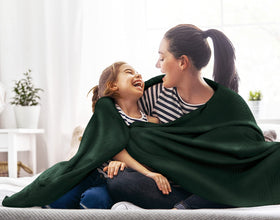 Utopia Bedding forest green blanket draped over sofa for cozy evenings