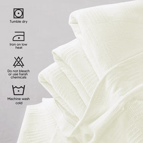 Ivory Utopia Bedding blanket draped on a couch for decor and warmth