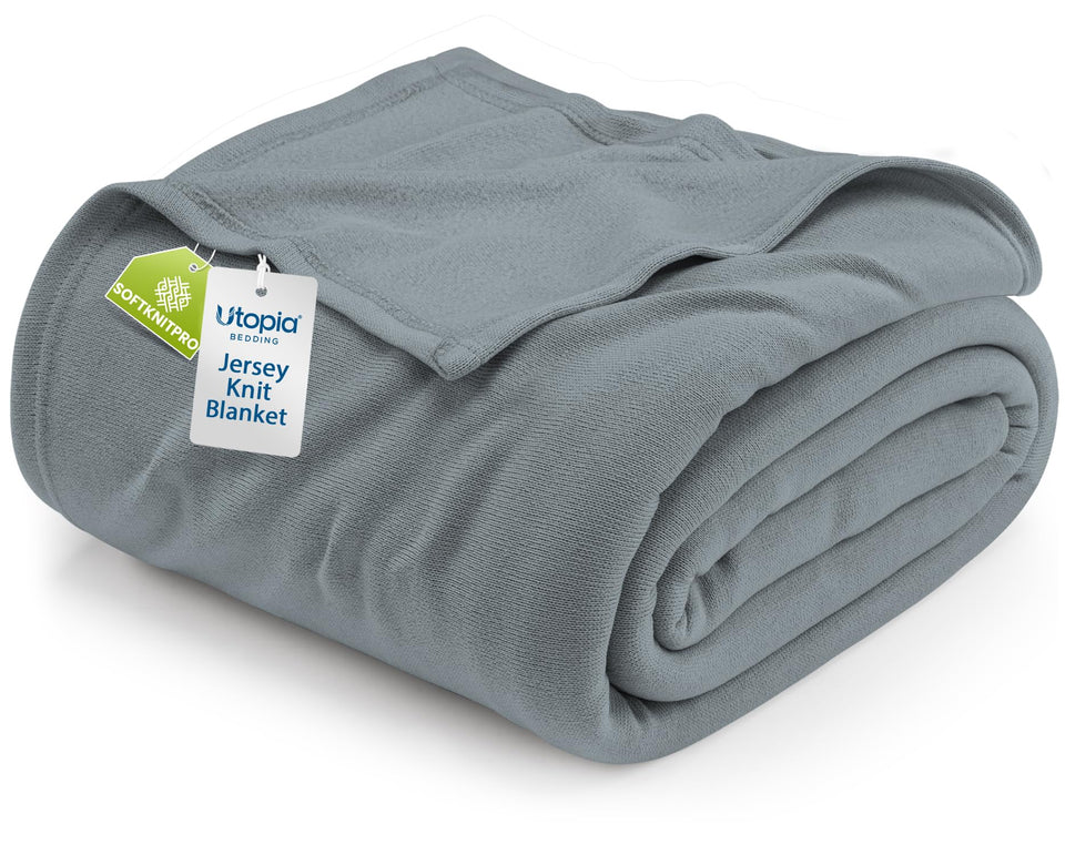 Utopia Bedding knit blanket grey on a bed, offering breathable warmth.