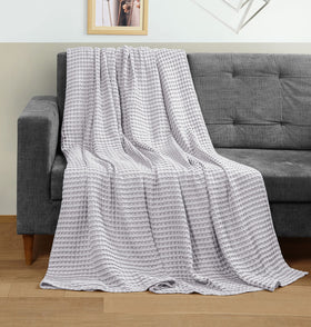 Lightweight Utopia Bedding blanket draped over bed demonstrating breathable comfort.