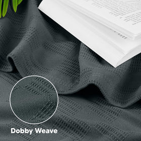 Utopia Bedding lightweight blanket draped over a couch for cozy décor