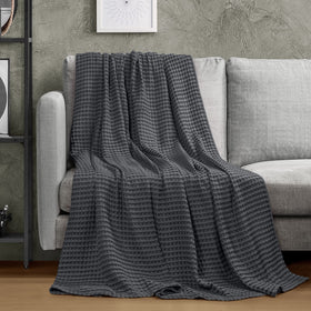 Utopia Bedding lightweight blanket demonstrates breathable fabric for year-round use.