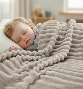 Utopia Bedding linen striped fleece blanket folded neatly, showcasing compact warmth for travel or home