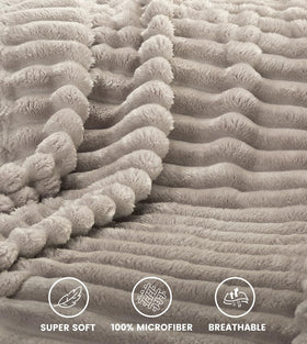 Utopia Bedding linen striped fleece blanket draped over a sofa illustrates cozy lounge comfort