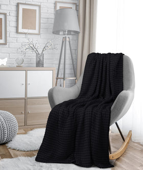 Utopia Bedding waffle-weave throw on couch complements modern decor.