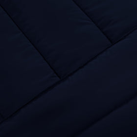 Utopia Bedding Navy lightweight bedding laid on a bed for year-round comfort.
