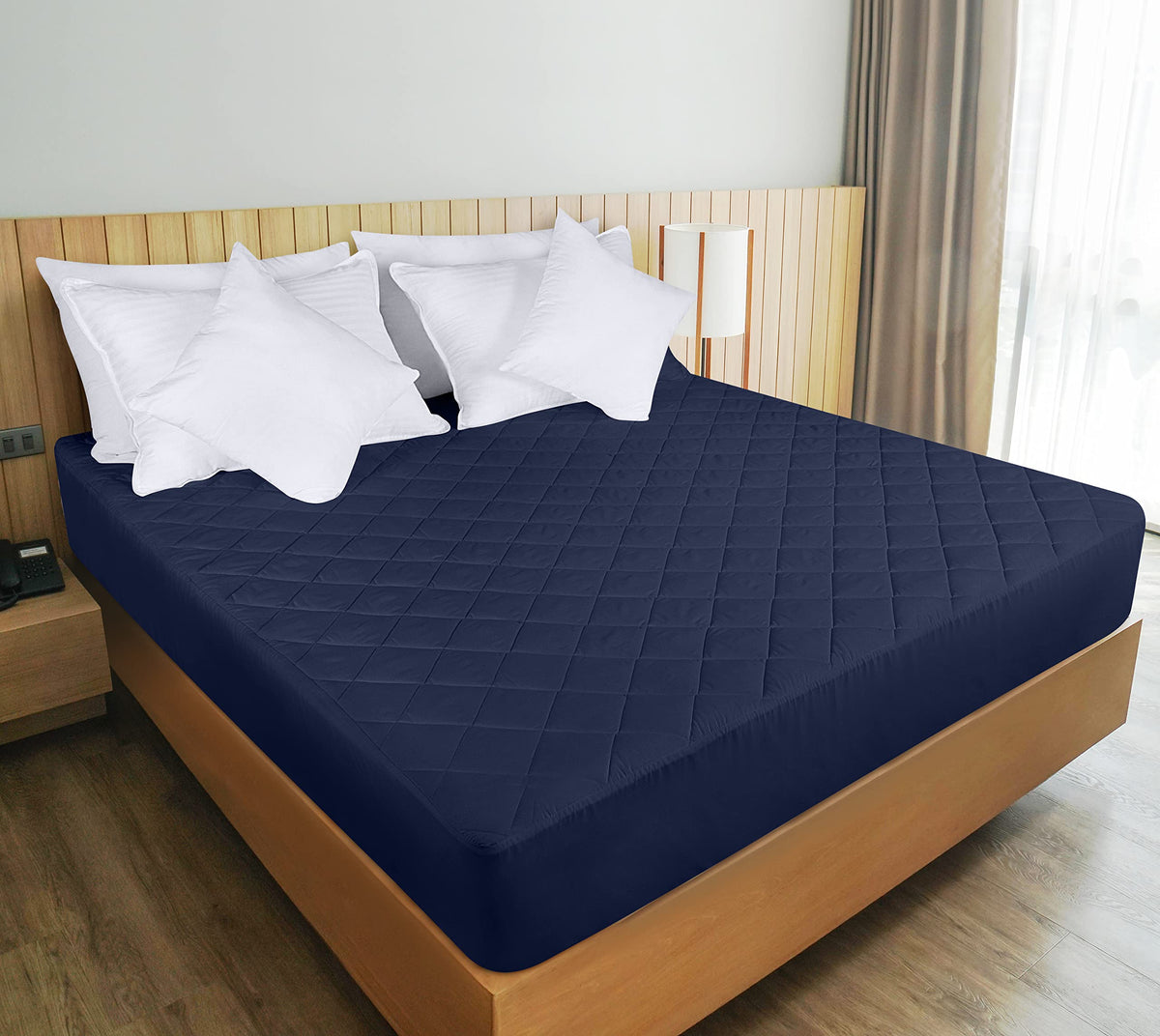 Navy quilted texture enhances bedroom aesthetics with breathable comfort.