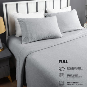 On-bed shot shows light grey color for versatile bedroom styling with this set