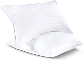 Pillows arranged for back, side, and stomach sleepers with a hint of loft.
