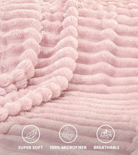 Utopia Bedding pink striped fleece blanket wrapped around shoulders for lightweight warmth