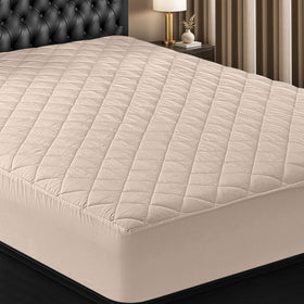 Utopia Bedding quilted fitted mattress pad on king bed, delivering soft loft and protection