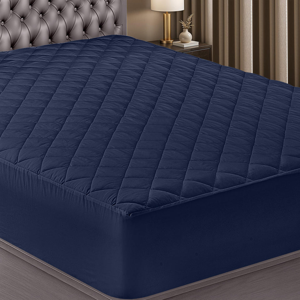 Utopia Bedding quilted fitted mattress pad navy top view highlights secure elastic fit and soft loft.