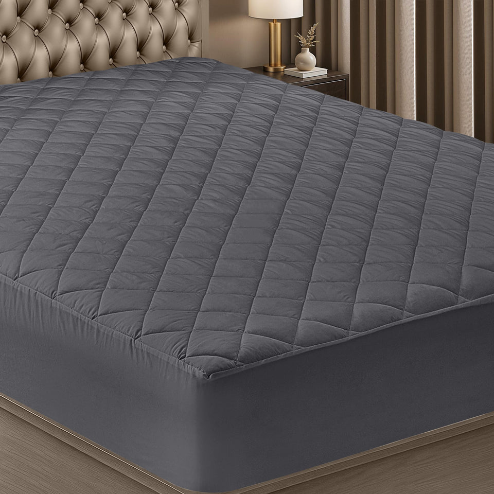 Utopia Bedding quilted fitted mattress pad in grey protects a queen bed with a soft, breathable cover.