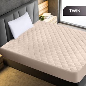 Utopia Bedding quilted fitted mattress pad on bed with breathable surface for comfortable sleep